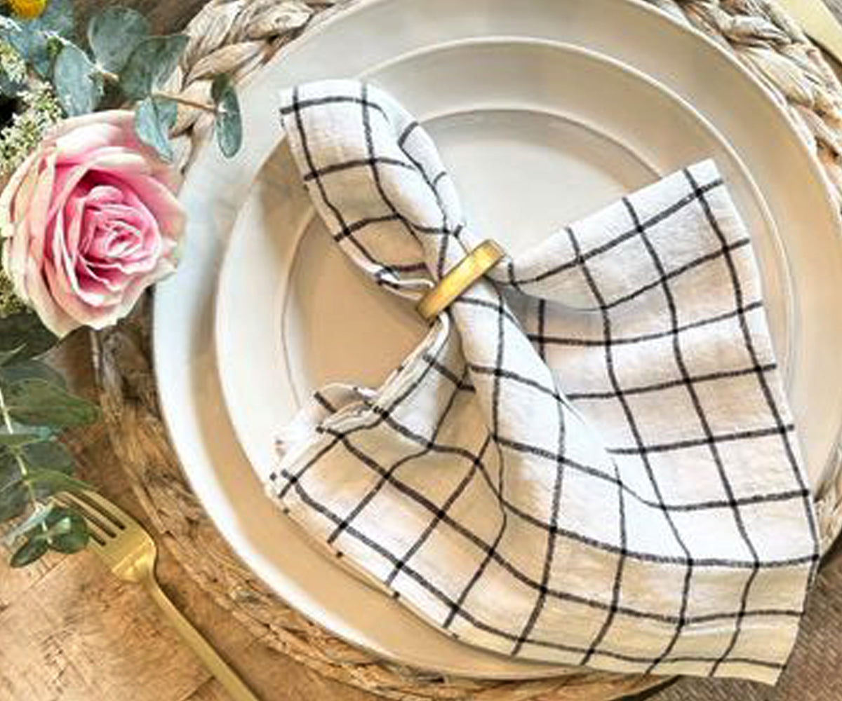 An image of black and white linen napkins used for a wedding reception, adds an elegant touch. An image of black and white linen napkins used for a wedding reception, adds an elegant touch.