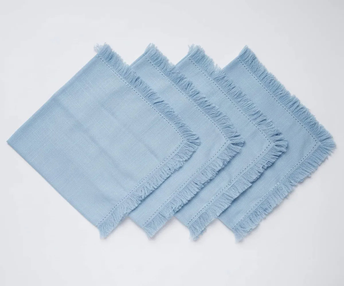 Blue cotton cloth napkins with decorative fringe edges, made from 100% soft and durable cotton fabric. Reusable eco-friendly napkins ideal for everyday dining, weddings, dinner parties, and elegant table settings. Blue cotton cloth napkins with decorative fringe edges, made from 100% soft and durable cotton fabric. Reusable eco-friendly napkins ideal for everyday dining, weddings, dinner parties, and elegant table settings.