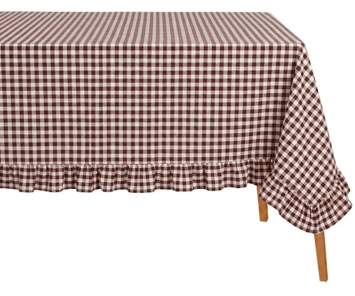Vintage inspired gingham tablecloth with elegant ruffle trim for a warm and timeless tablescape Vintage inspired gingham tablecloth with elegant ruffle trim for a warm and timeless tablescape