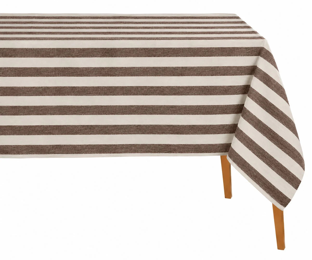 Coffee brown and white cabana striped cotton tablecloth draped over a wooden table Coffee brown and white cabana striped cotton tablecloth draped over a wooden table