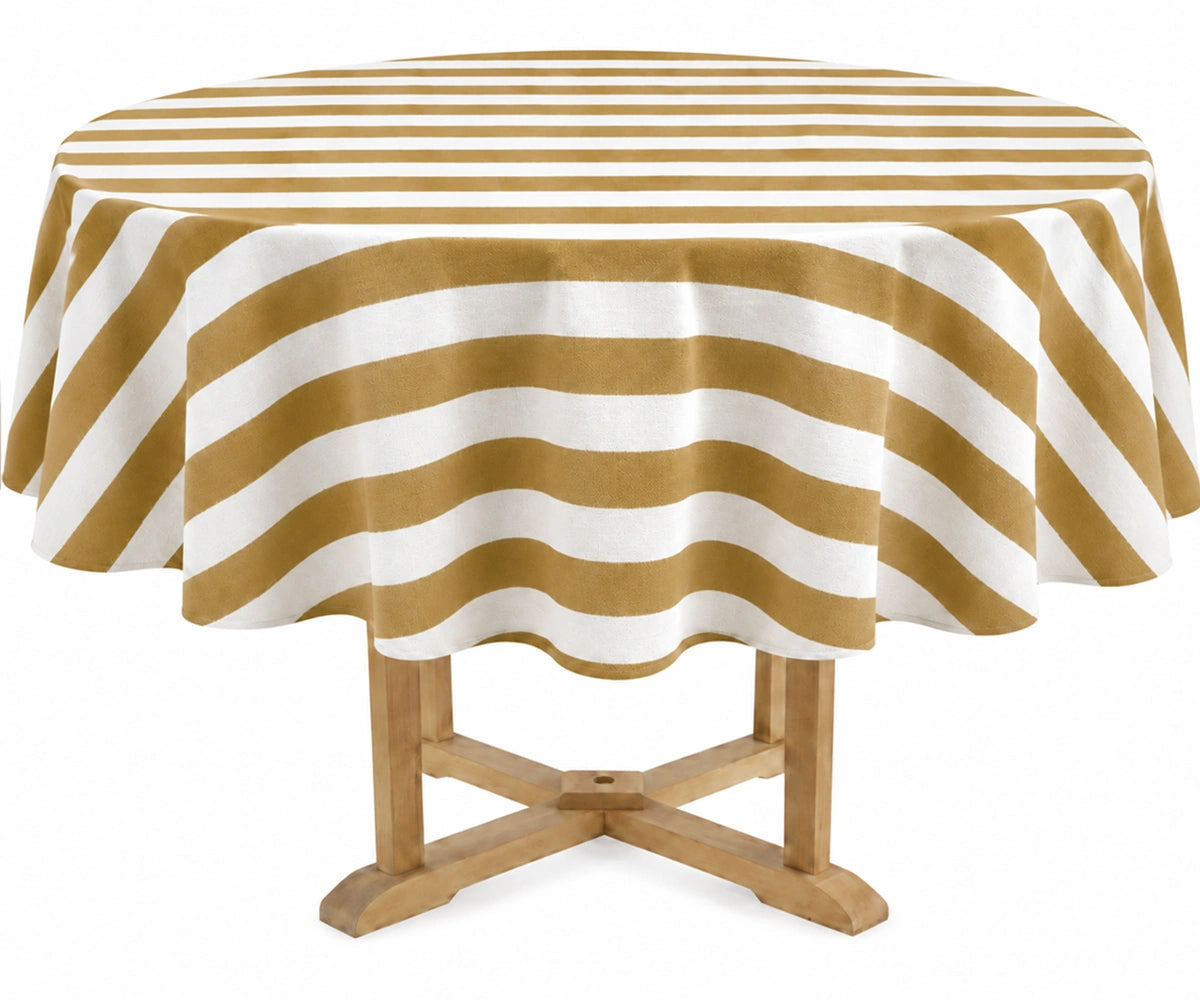 A round table covered with a mustard and off-white striped tablecloth, shown on a light wood pedestal table against a plain white background. A round table covered with a mustard and off-white striped tablecloth, shown on a light wood pedestal table against a plain white background.