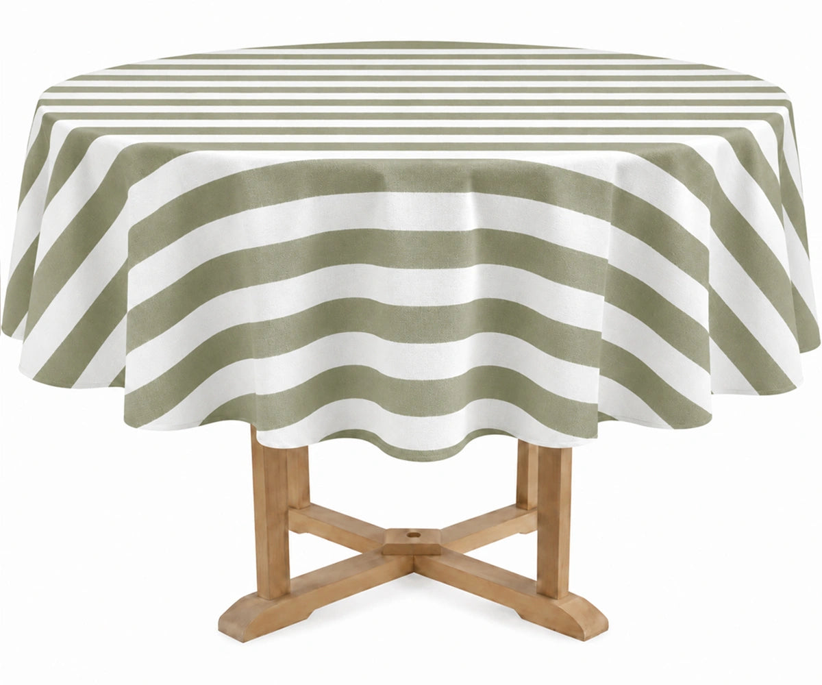 A round table covered with a sage and off-white striped tablecloth, shown on a light wood pedestal table against a plain white background. A round table covered with a sage and off-white striped tablecloth, shown on a light wood pedestal table against a plain white background.