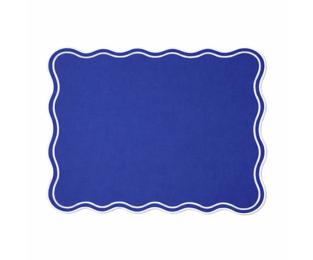 Modern dining table placemats in rectangle shape with soft cotton fabric and white scalloped trim Modern dining table placemats in rectangle shape with soft cotton fabric and white scalloped trim