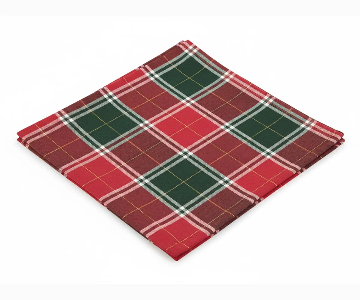 Red, white, and green buffalo plaid Christmas cloth napkins made from 100% cotton, neatly folded and displayed for holiday or farmhouse-style table settings. Red, white, and green buffalo plaid Christmas cloth napkins made from 100% cotton, neatly folded and displayed for holiday or farmhouse-style table settings.