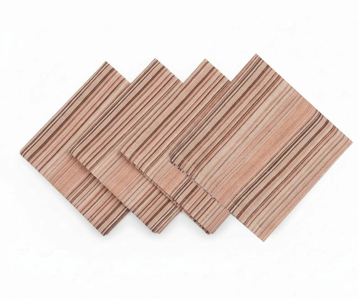 Beige striped cotton dinner napkins folded and stacked for table setting Beige striped cotton dinner napkins folded and stacked for table setting