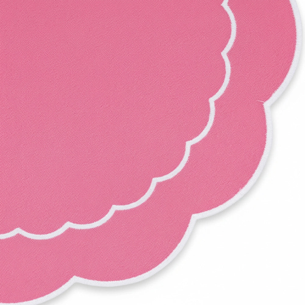 Soft pink cotton round placemat with scalloped edge Soft pink cotton round placemat with scalloped edge