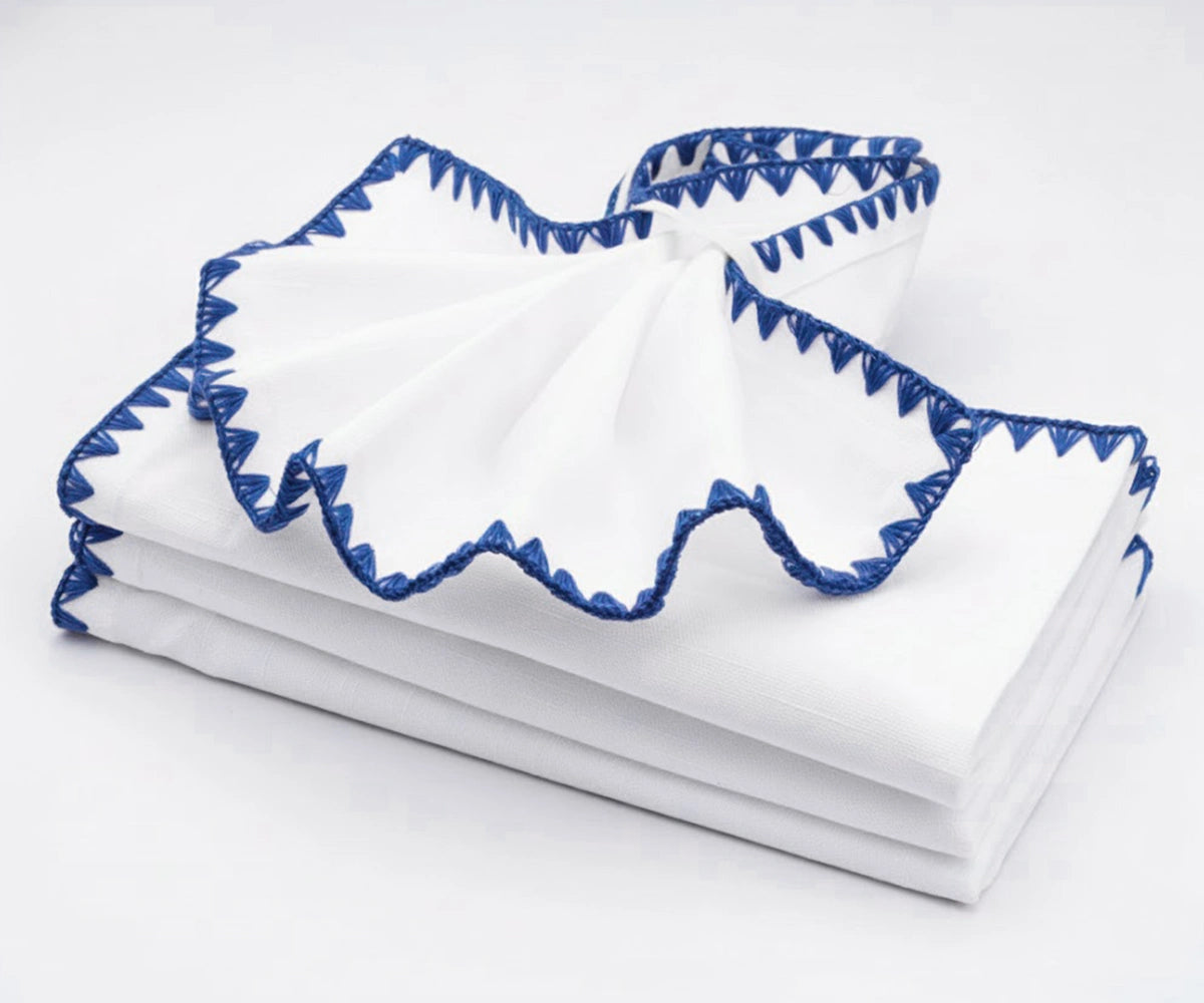 White and blue embroidered dinner napkins – soft cotton reusable napkins for kitchen and dining tables. White and blue embroidered dinner napkins – soft cotton reusable napkins for kitchen and dining tables.