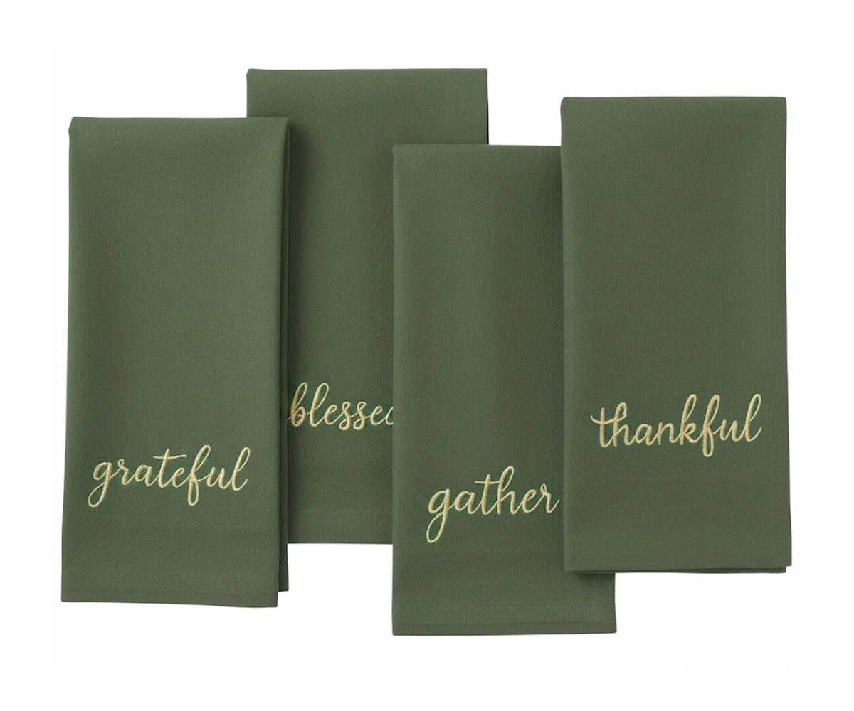 Light green sentiment embroidered napkin with gold stitching for winter and Christmas décor. Light green sentiment embroidered napkin with gold stitching for winter and Christmas décor.