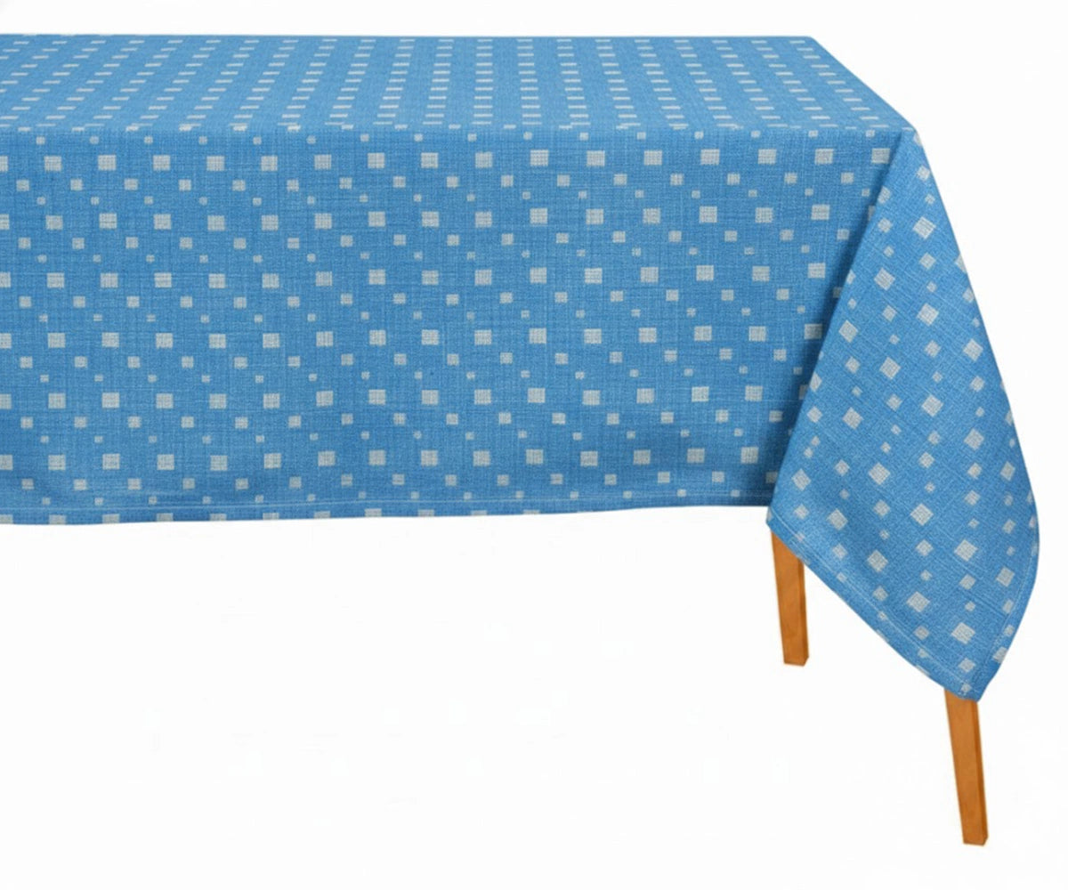 Blue and white geometric cotton tablecloth on rectangular dining table with modern table setting Blue and white geometric cotton tablecloth on rectangular dining table with modern table setting