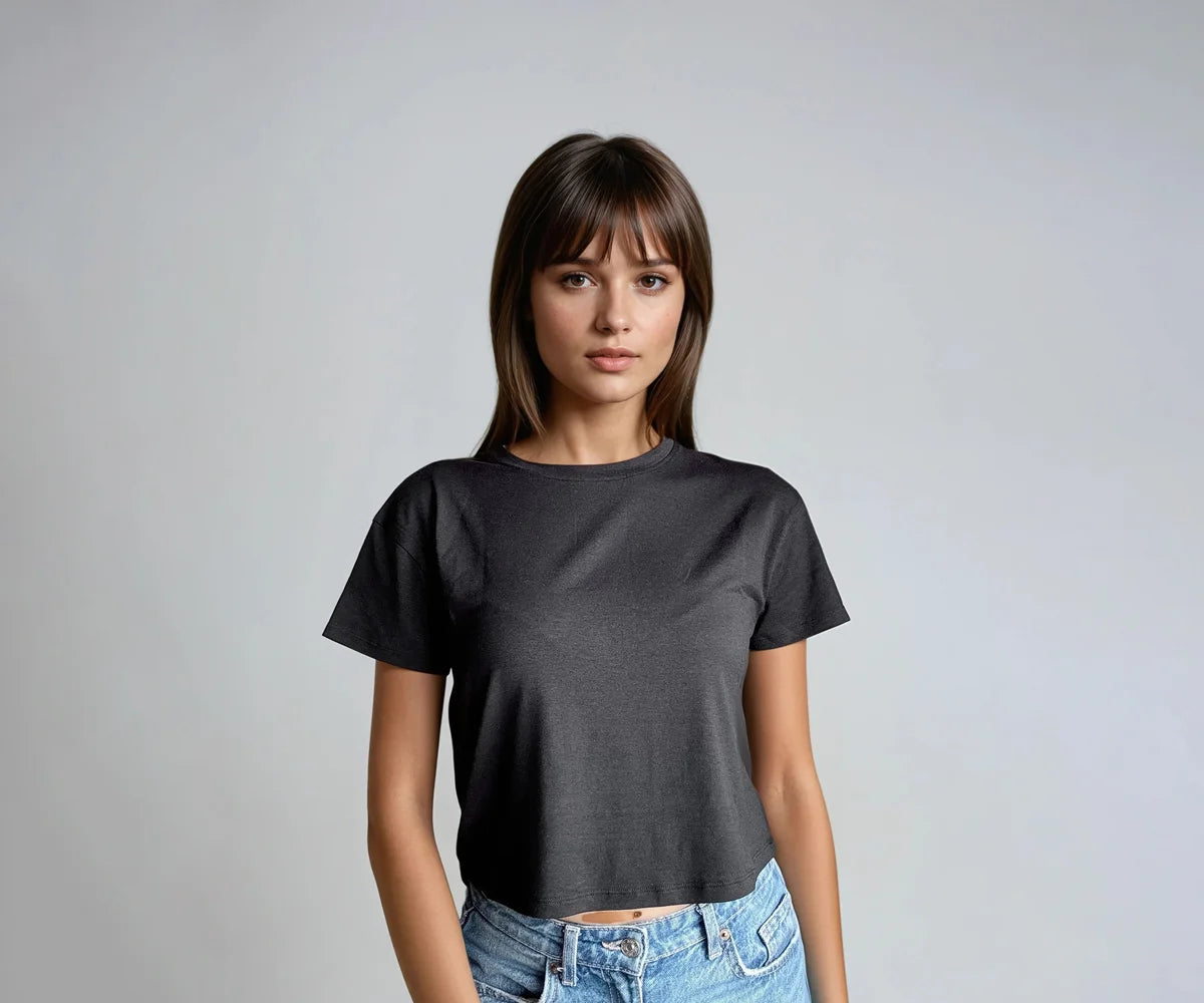 Woman wearing a black crop top with short sleeves Woman wearing a black crop top with short sleeves