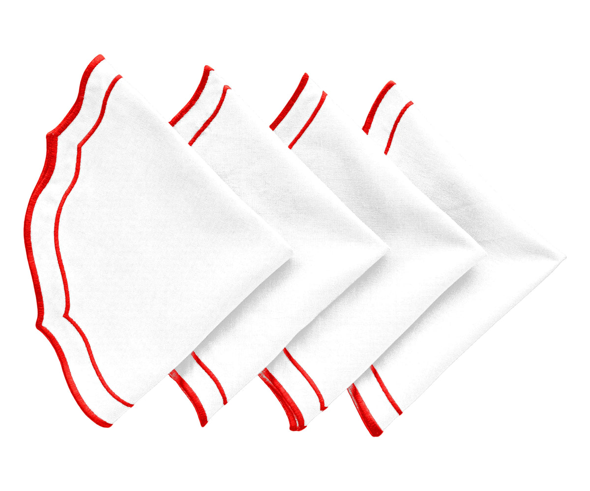 Close-up of red cotton placemat with scalloped edges Close-up of red cotton placemat with scalloped edges