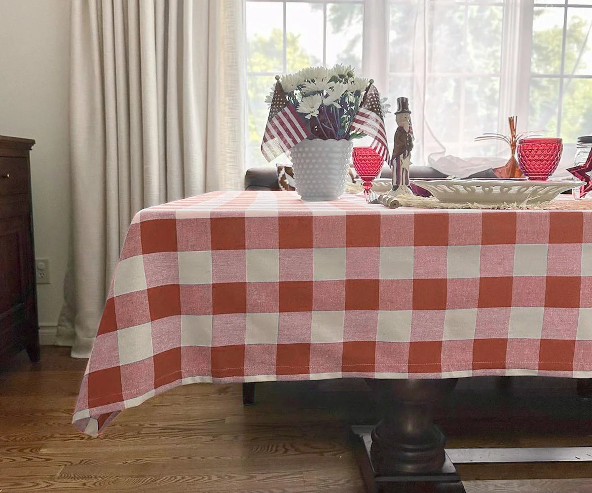 Dark orange and white checkered tablecloth on dining table Dark orange and white checkered tablecloth on dining table