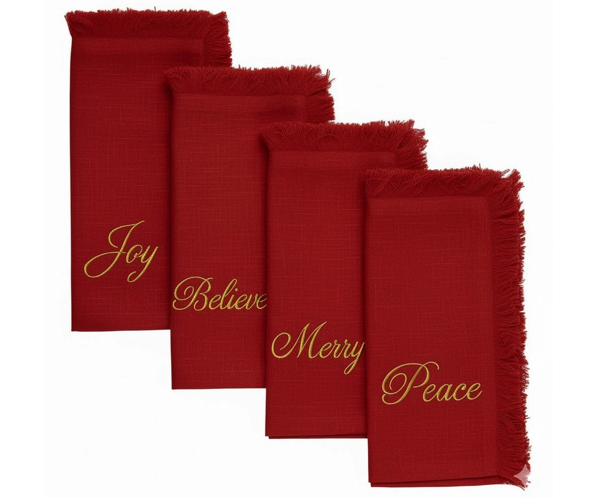 Deep red embroidered napkins with gold thread and fringed edges for festive dining and holiday celebrations Deep red embroidered napkins with gold thread and fringed edges for festive dining and holiday celebrations