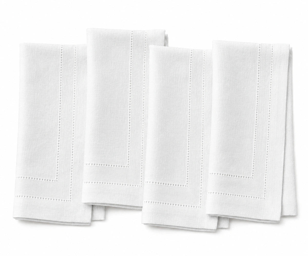 White linen napkins with double hemstitch, luxury cloth dinner napkins for weddings, fine dining, restaurants, and formal table settings. White linen napkins with double hemstitch, luxury cloth dinner napkins for weddings, fine dining, restaurants, and formal table settings.