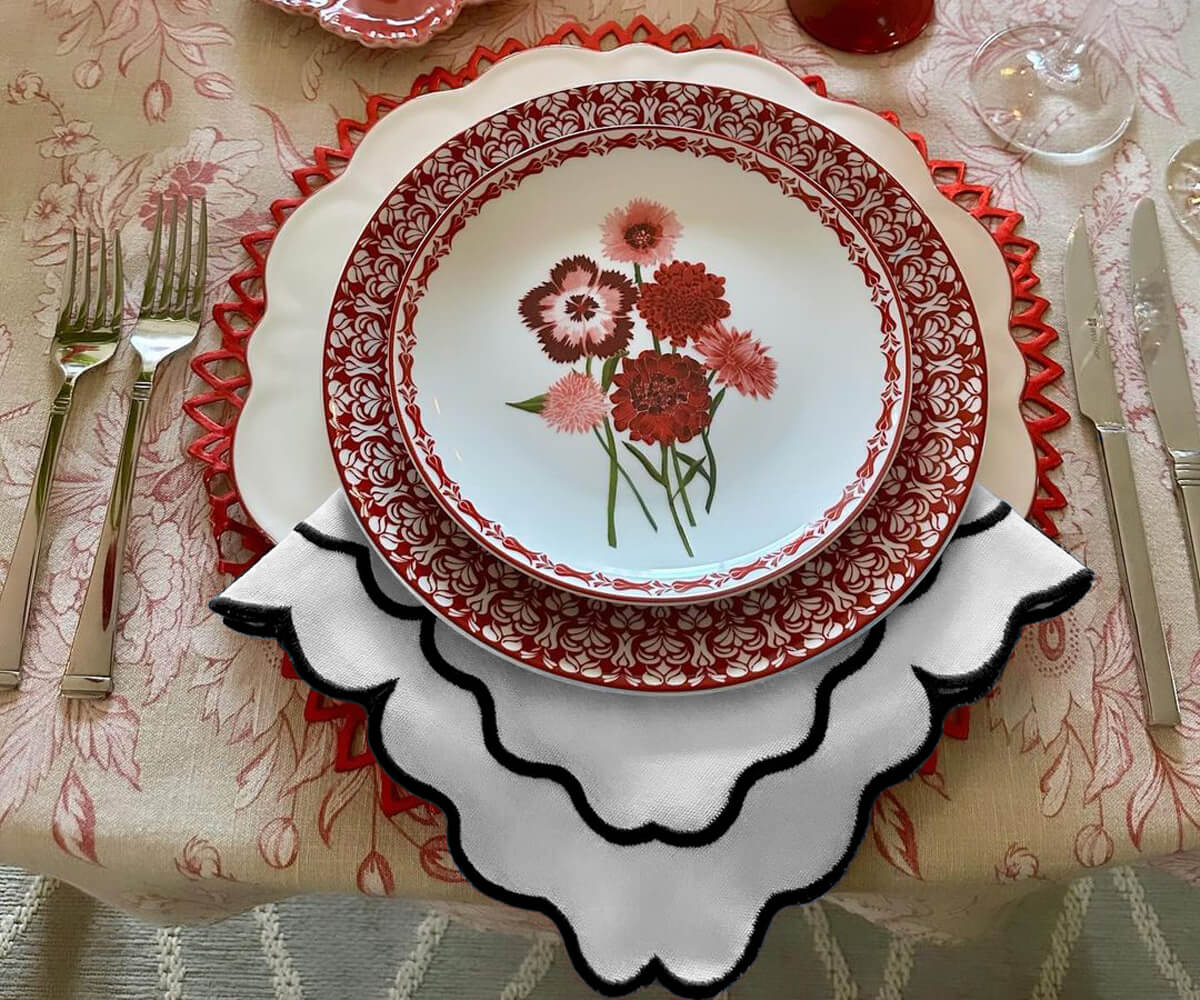 Black scalloped edge napkins offering a touch of refinement to your table decor. Black scalloped edge napkins offering a touch of refinement to your table decor.