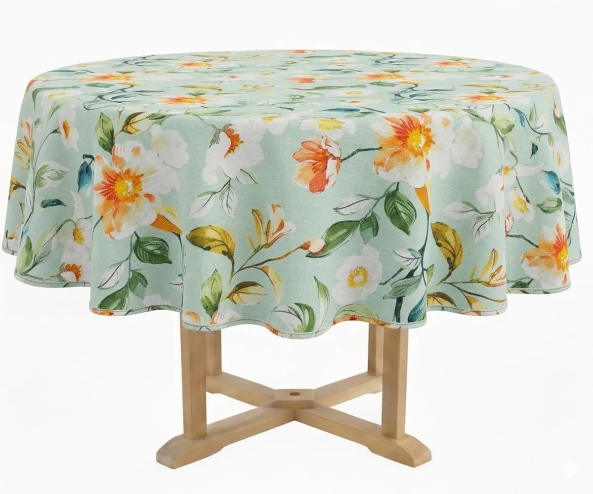 Round tablecloth with garden-inspired floral design displayed on a wooden pedestal table with soft draping edges. Round tablecloth with garden-inspired floral design displayed on a wooden pedestal table with soft draping edges.
