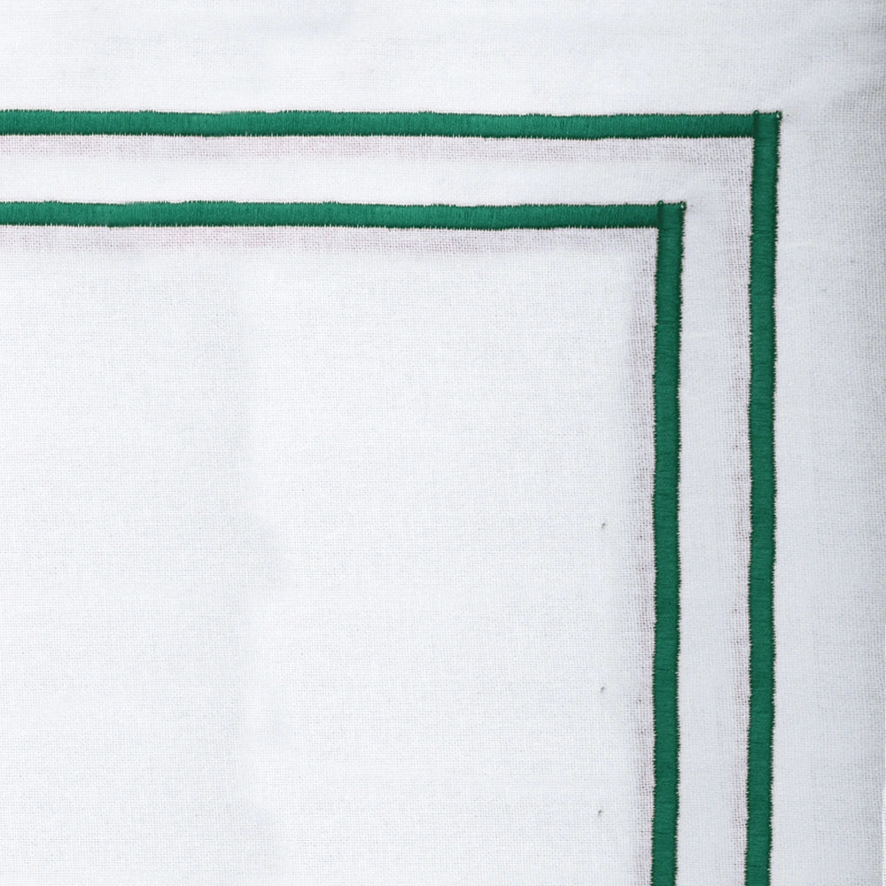 Green embroidered cotton napkins styled on dining table, luxury fabric napkins for weddings and holiday décor Green embroidered cotton napkins styled on dining table, luxury fabric napkins for weddings and holiday décor