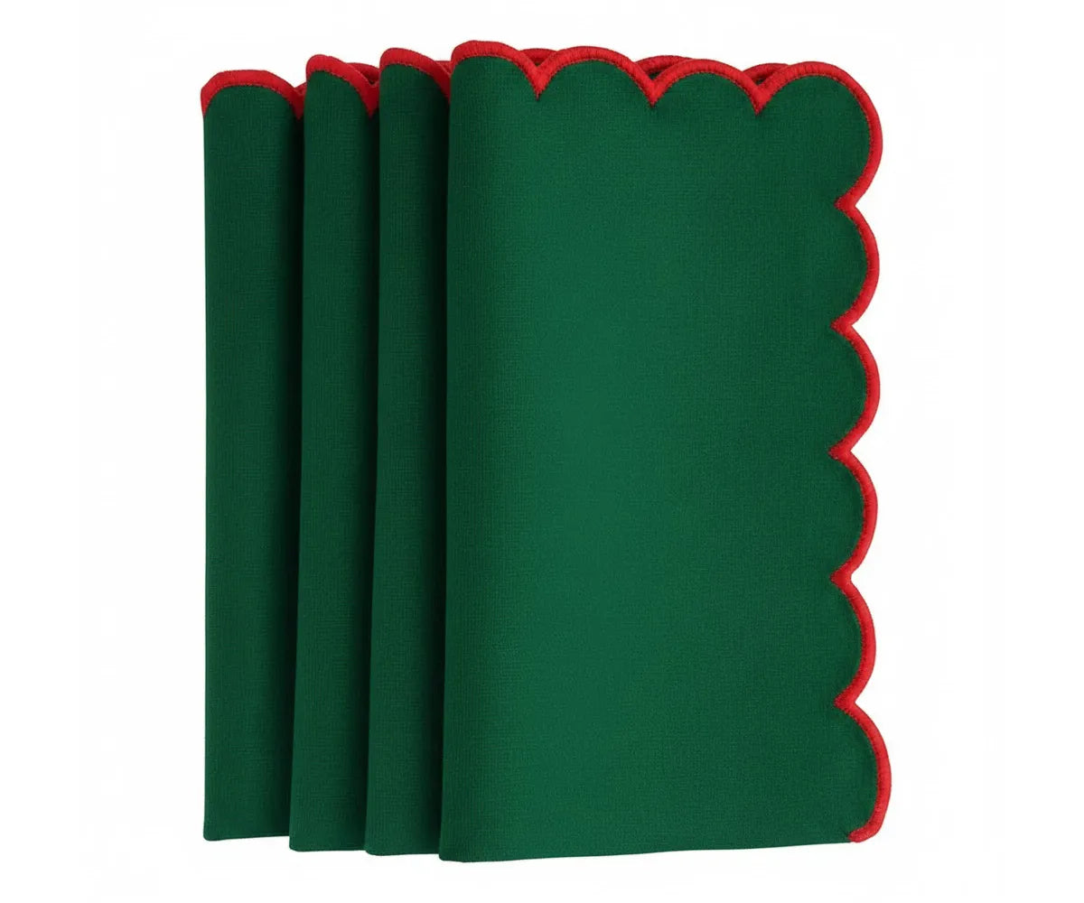 Classic scalloped dining napkins featuring red trim accents Classic scalloped dining napkins featuring red trim accents