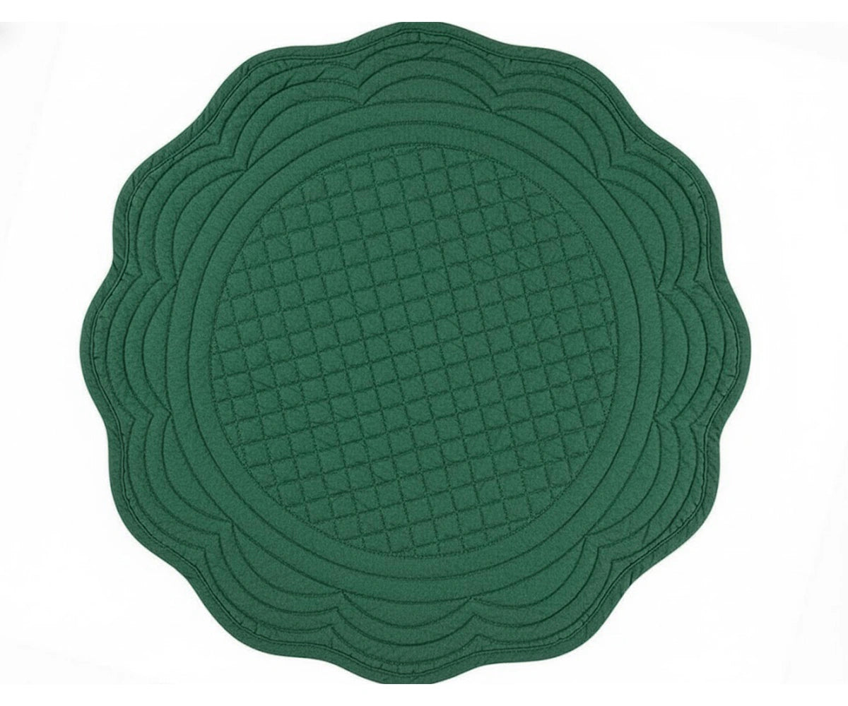 Green quilted round placemat with scalloped edge for fresh everyday and festive table décor Green quilted round placemat with scalloped edge for fresh everyday and festive table décor