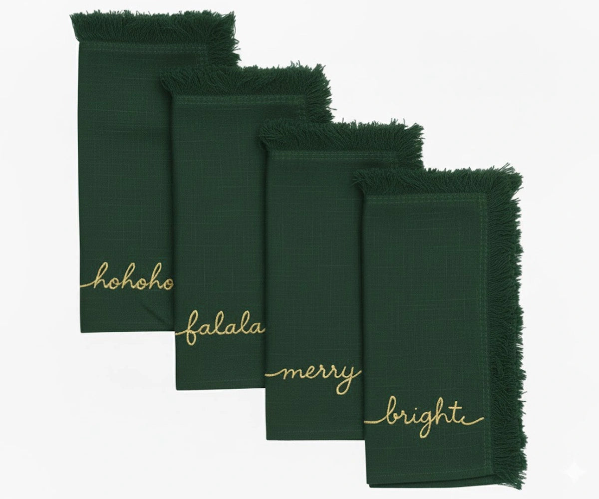 Green embroidered Christmas napkins with gold stitching and fringed edges for festive table décor Green embroidered Christmas napkins with gold stitching and fringed edges for festive table décor