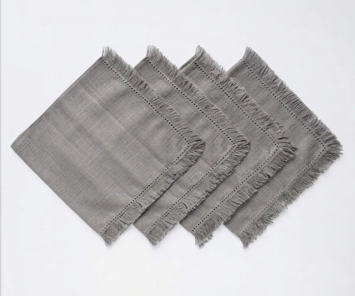 Reusable fringed cotton napkins with soft fabric construction, ideal for dinner tables, gatherings, and everyday dining. Reusable fringed cotton napkins with soft fabric construction, ideal for dinner tables, gatherings, and everyday dining.