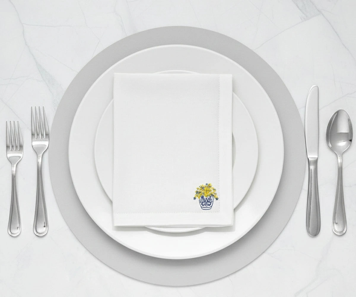 printed cotton napkin featuring delicate yellow flowers in blue pot on white base, reusable cloth napkin printed cotton napkin featuring delicate yellow flowers in blue pot on white base, reusable cloth napkin