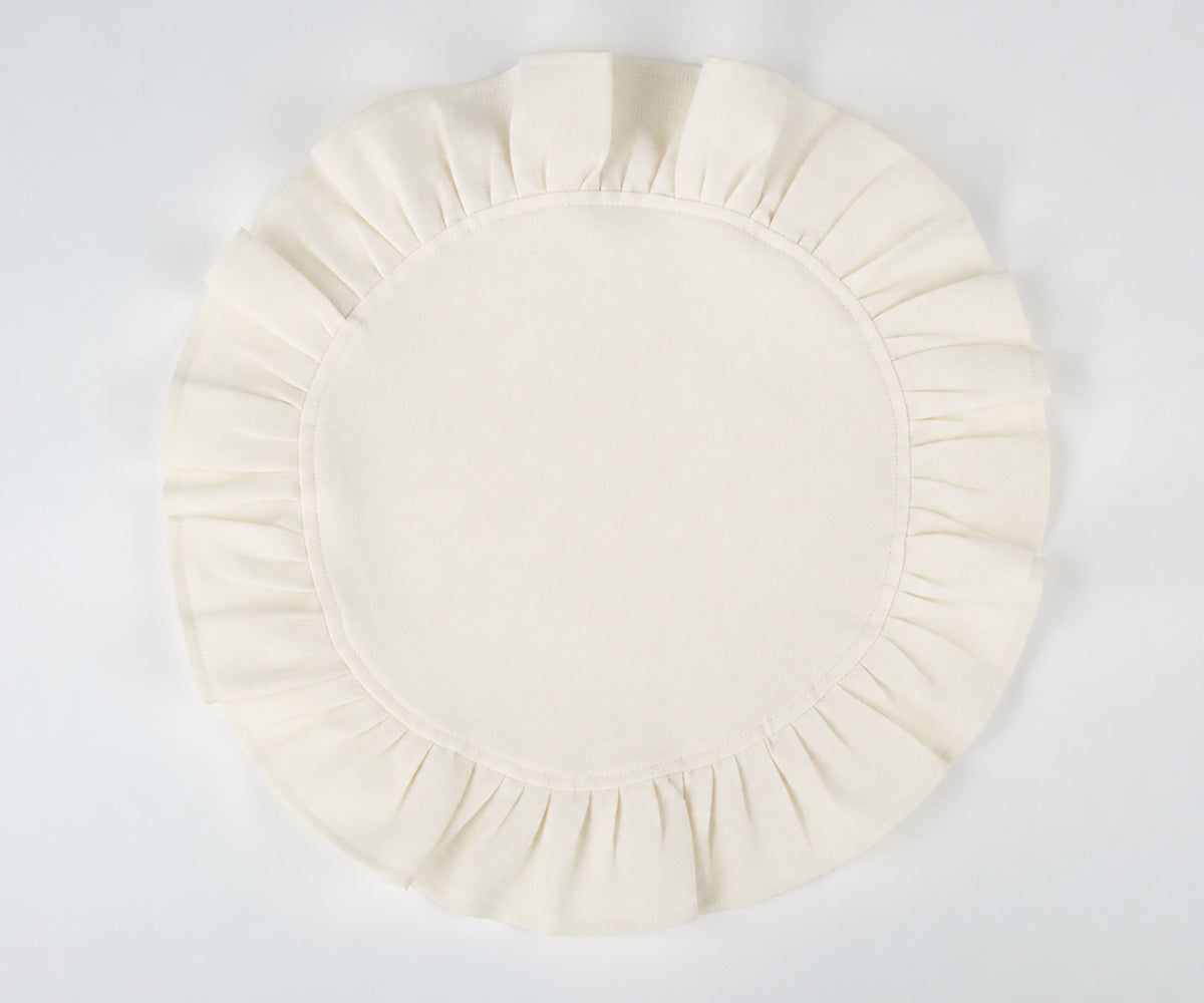 Ivory round ruffled cotton napkins with a clean linen look, perfect for classic table settings and formal occasions. Ivory round ruffled cotton napkins with a clean linen look, perfect for classic table settings and formal occasions.