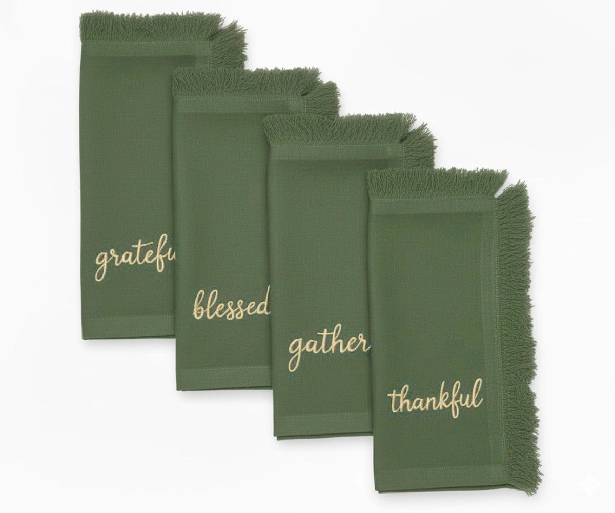 Green cotton fringe napkins with gold embroidered words – perfect for Christmas or holiday dining Green cotton fringe napkins with gold embroidered words – perfect for Christmas or holiday dining