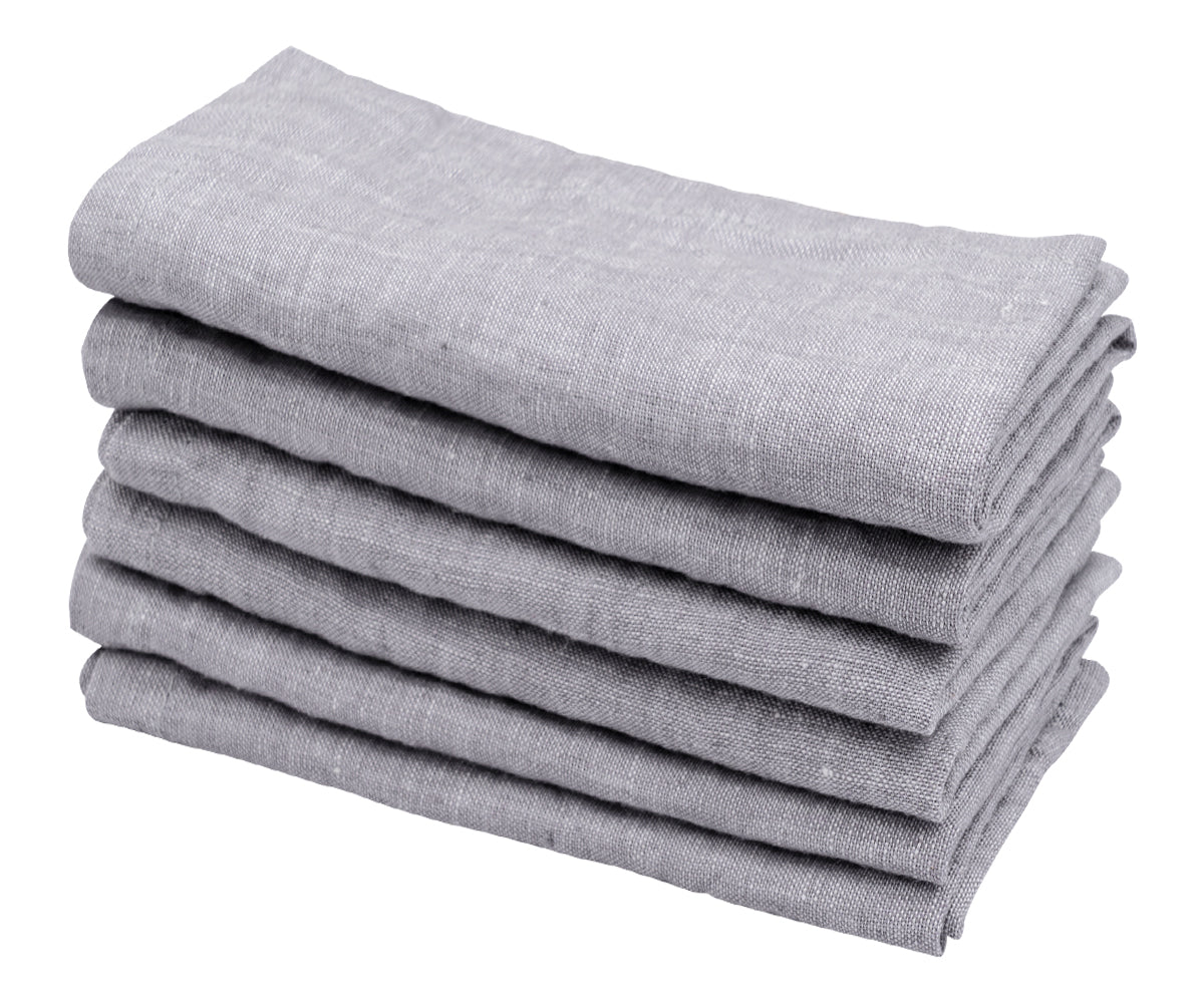 Expertly folded gray napkins, adding a touch of sophistication to your formal dining setting. Expertly folded gray napkins, adding a touch of sophistication to your formal dining setting.