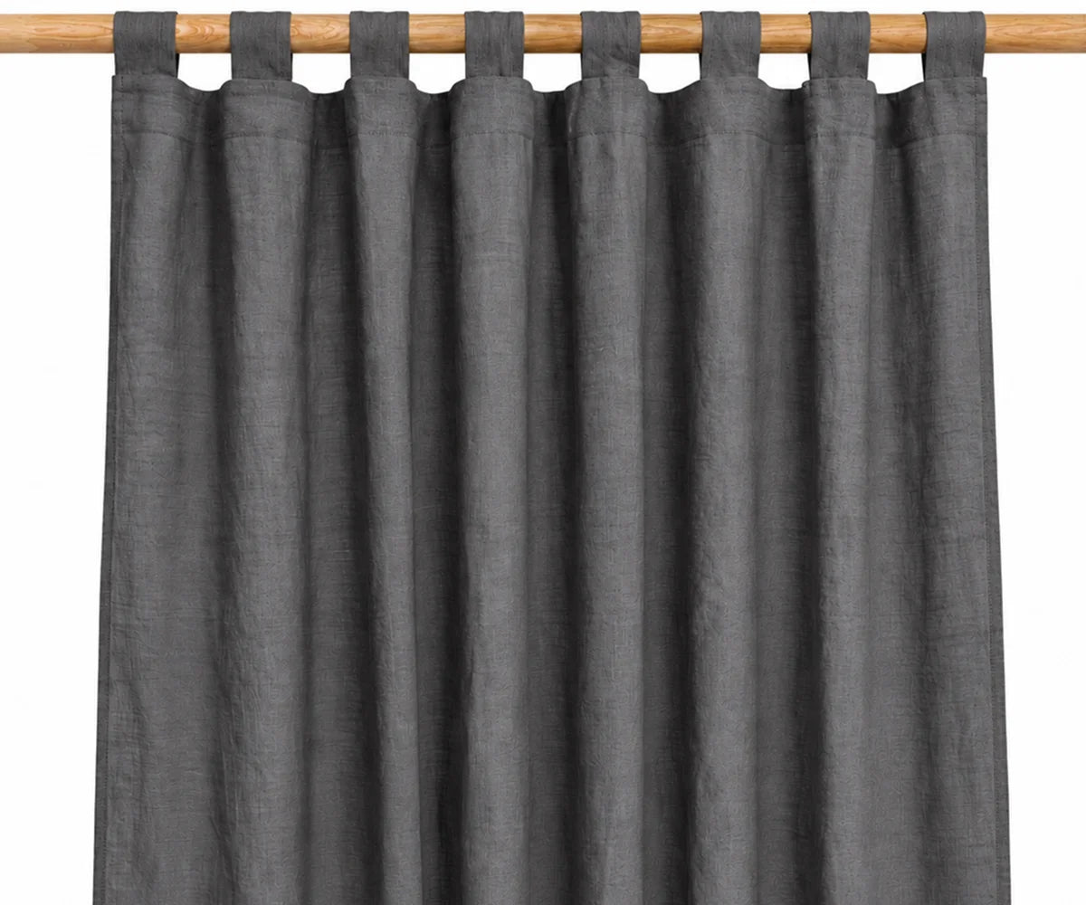 Charcoal gray linen window treatment with tab top hanging loops, durable 100% linen curtains for minimalist bedrooms, modern living rooms, and contemporary décor. Charcoal gray linen window treatment with tab top hanging loops, durable 100% linen curtains for minimalist bedrooms, modern living rooms, and contemporary décor.