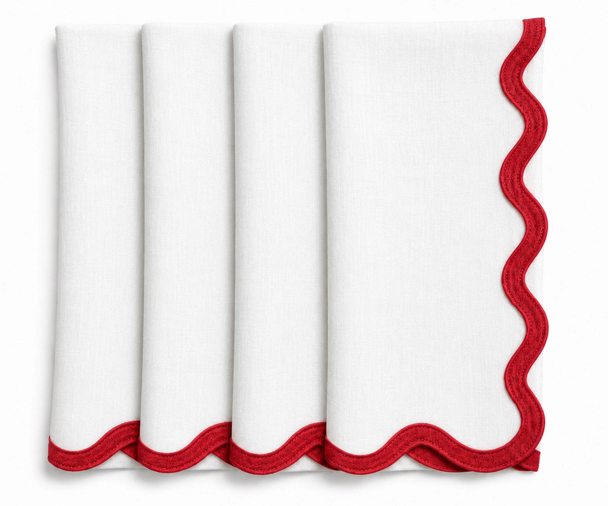 White linen scalloped edge napkins accented with red embroidery, timeless reusable dinner napkins for holiday meals and entertaining. White linen scalloped edge napkins accented with red embroidery, timeless reusable dinner napkins for holiday meals and entertaining.