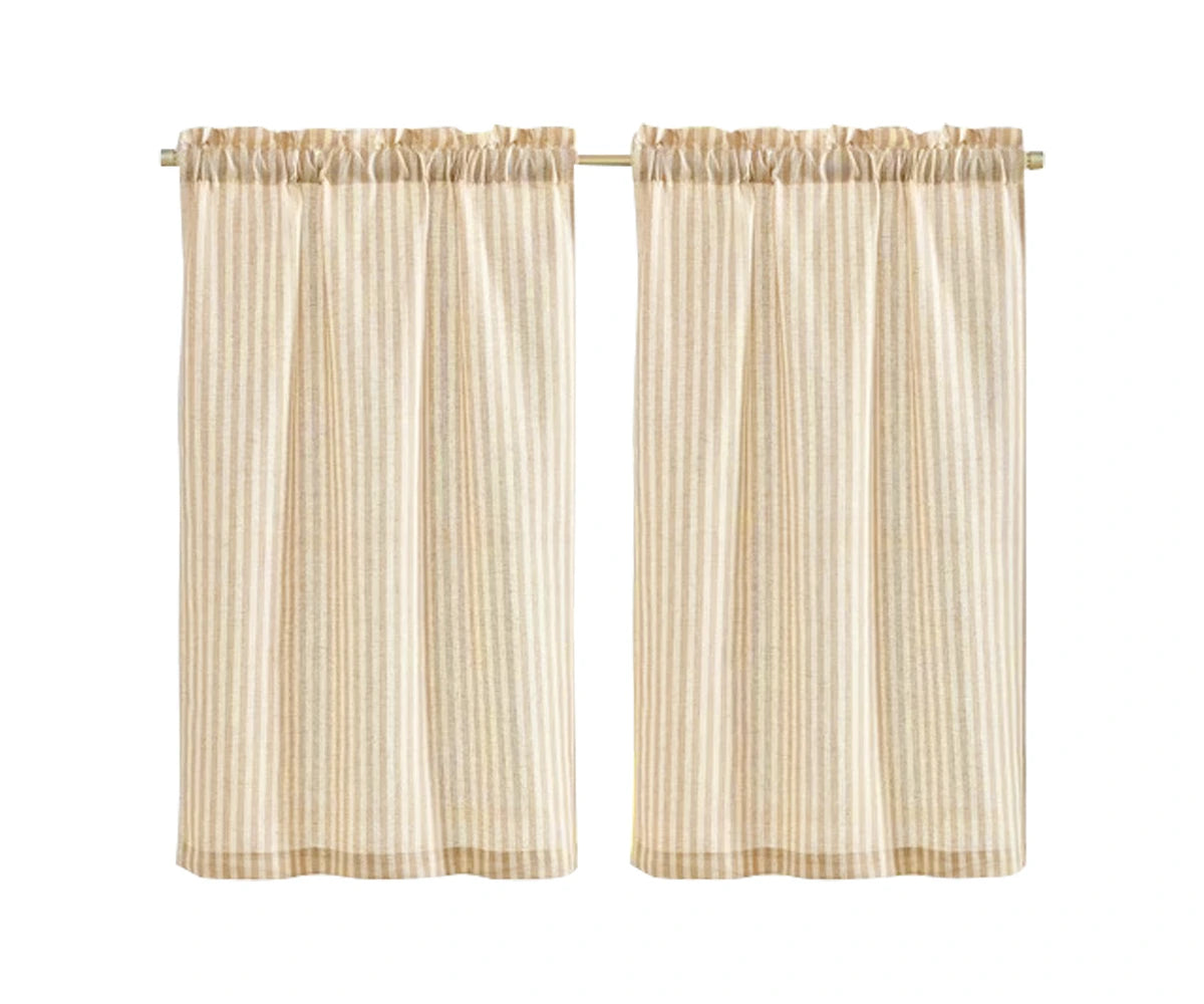 Beige 100% linen cafe curtains on a kitchen window above the sink, farmhouse style. Beige 100% linen cafe curtains on a kitchen window above the sink, farmhouse style.