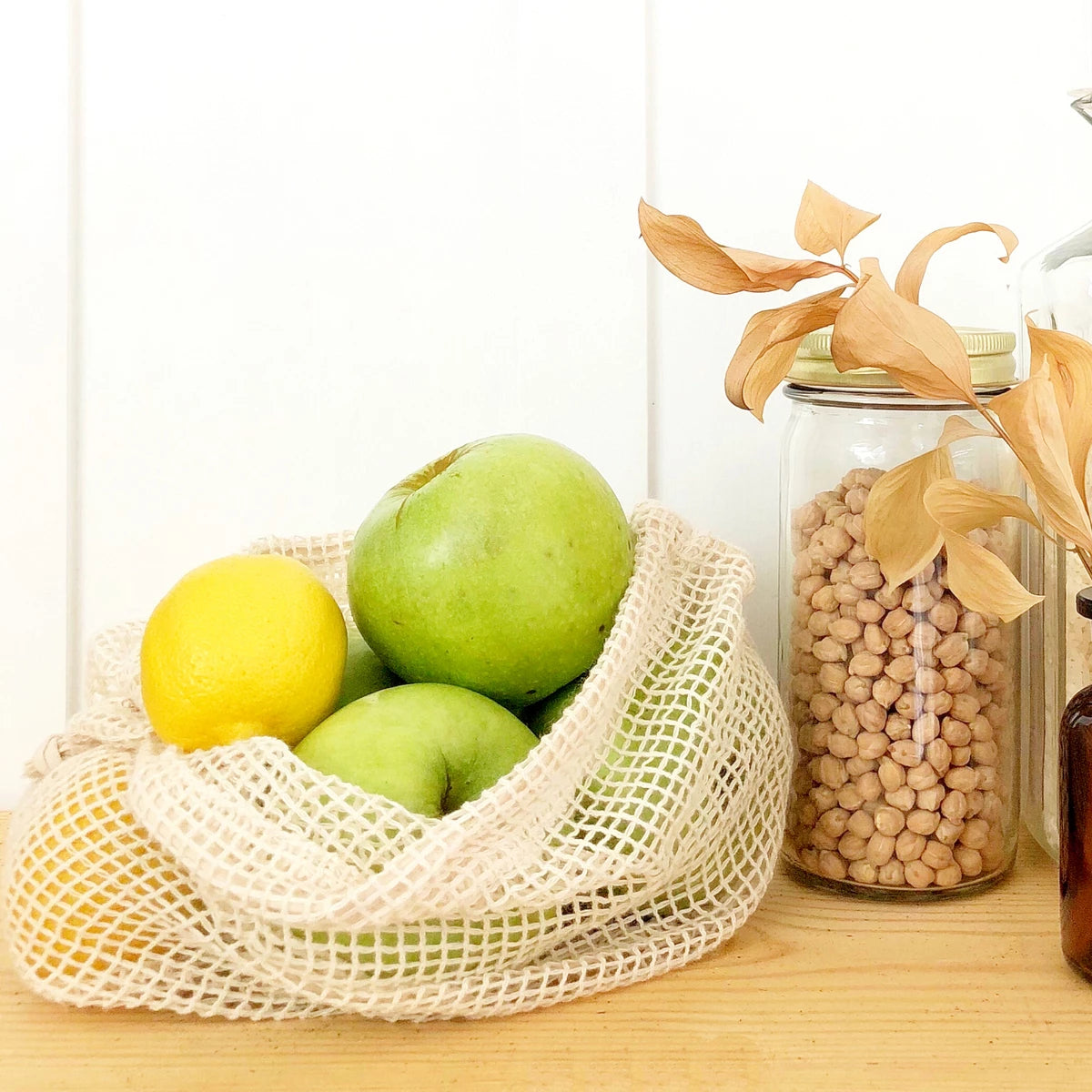 vegetable storage bags - Reusable produce bags hung on hooks in a zero-waste kitchen. vegetable storage bags - Reusable produce bags hung on hooks in a zero-waste kitchen.