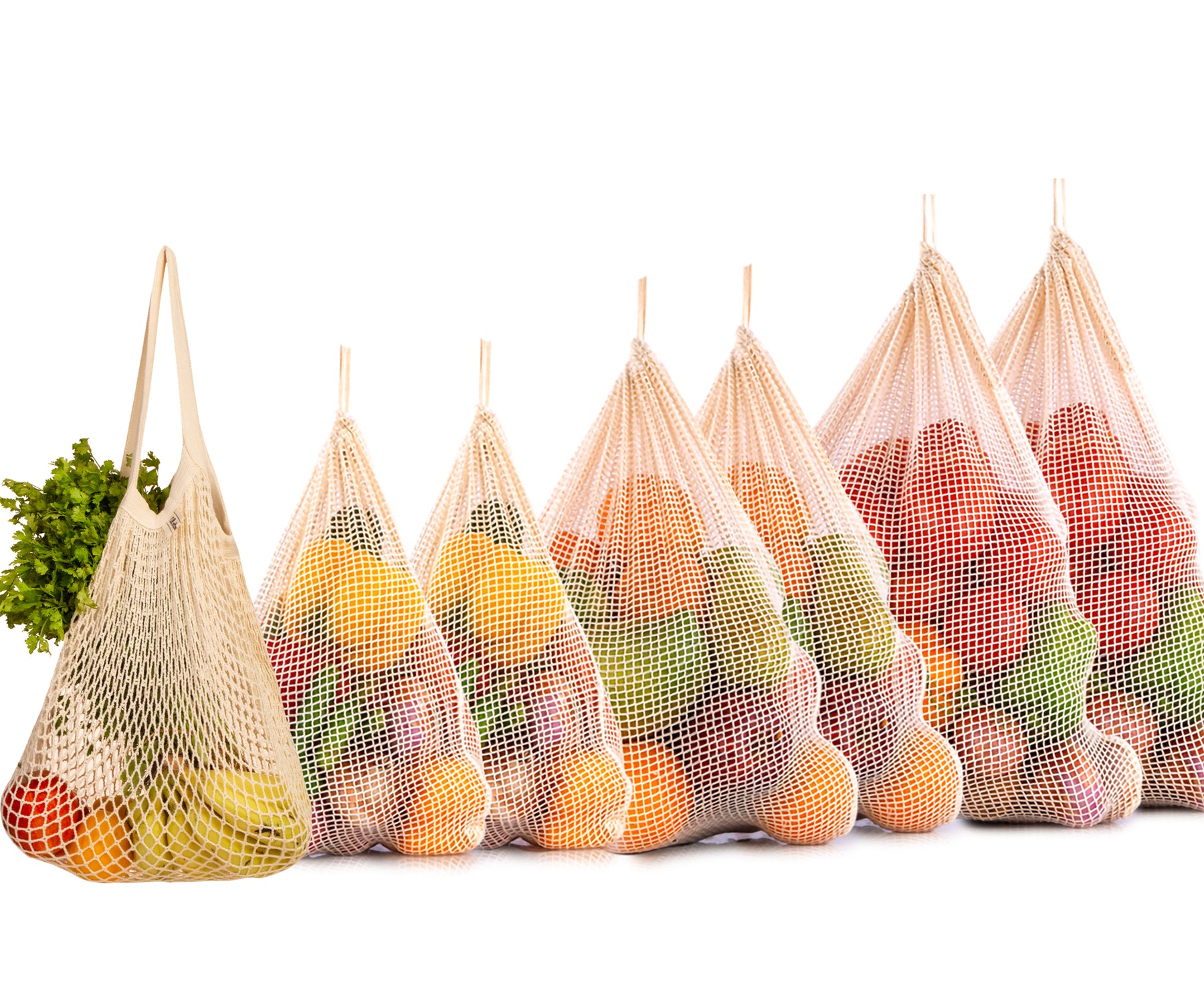 An assortment of five string bags, each filled with fresh produce An assortment of five string bags, each filled with fresh produce