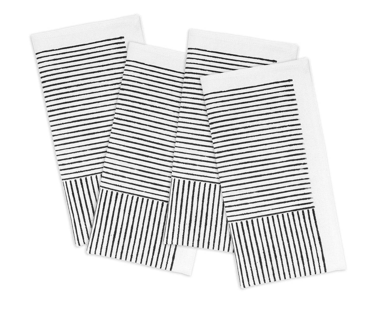 Cotton dinner napkins displayed on a modern table setup Cotton dinner napkins displayed on a modern table setup