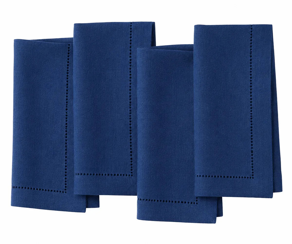 Fine linen dining napkins with mitered corners for luxury table presentation Fine linen dining napkins with mitered corners for luxury table presentation
