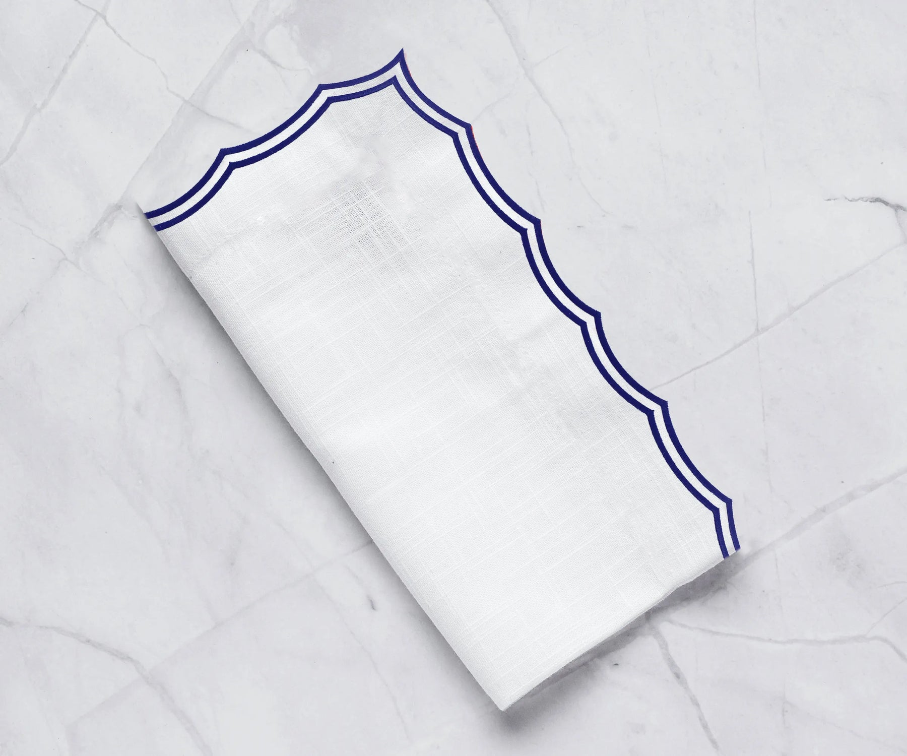 Navy cotton embroidered napkins with scalloped edges Navy cotton embroidered napkins with scalloped edges