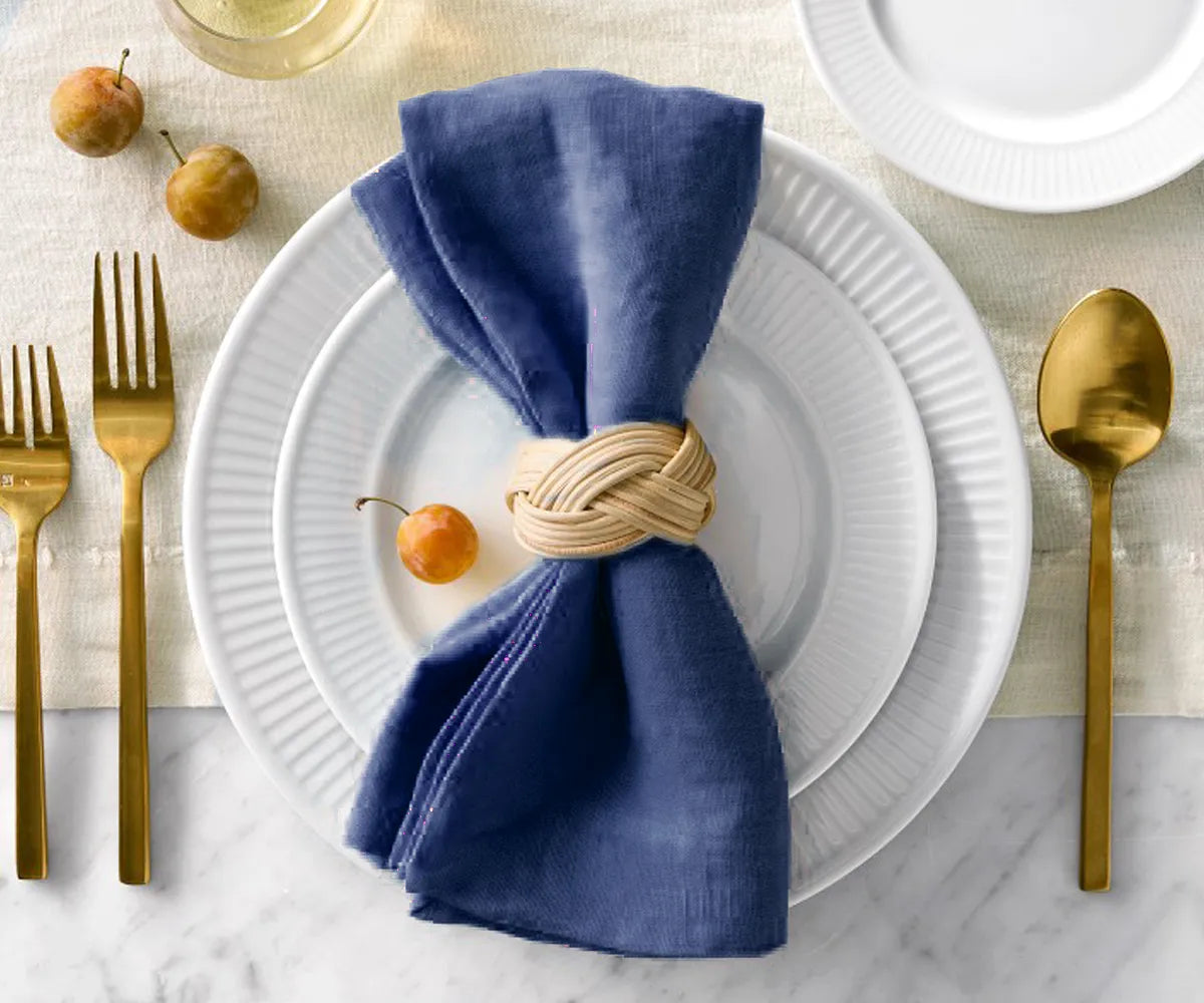 Eco-conscious dining setup with reusable linen napkins and bamboo utensils. Eco-conscious dining setup with reusable linen napkins and bamboo utensils.