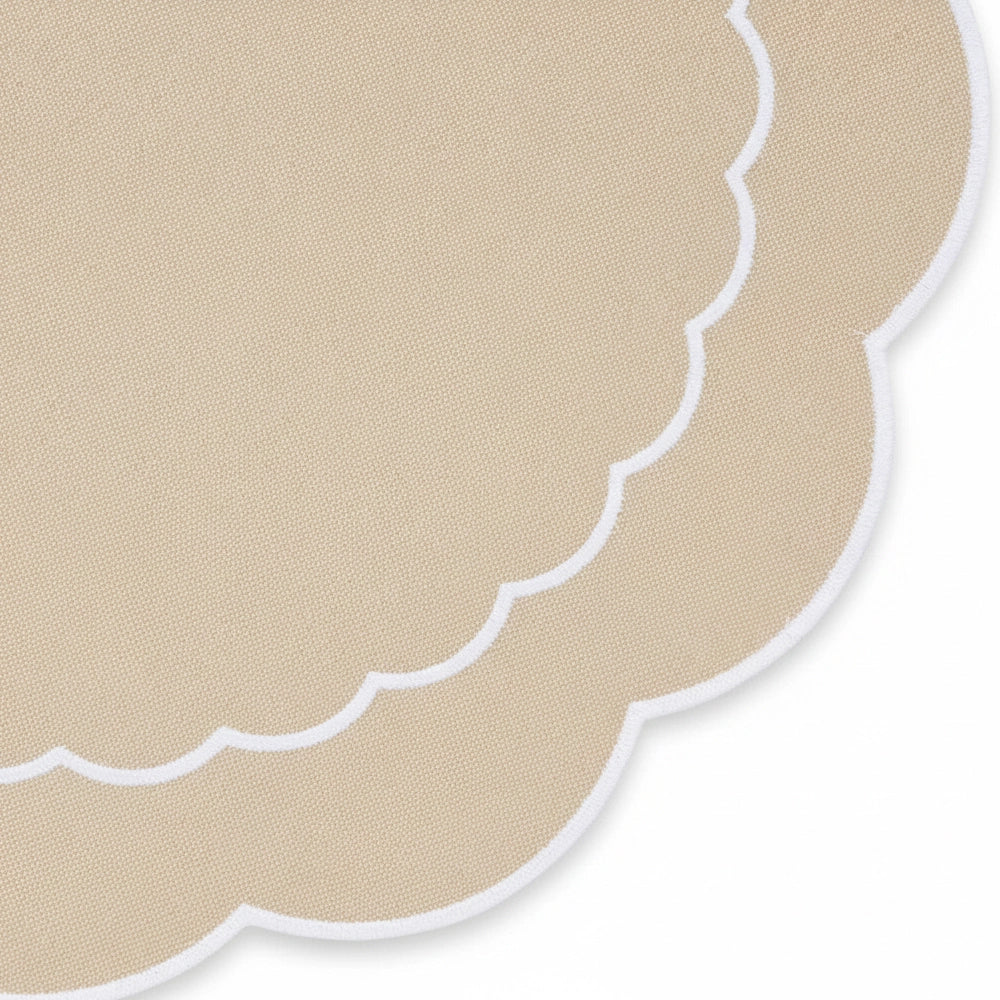 Round beige cotton scalloped placemat for table setting Round beige cotton scalloped placemat for table setting