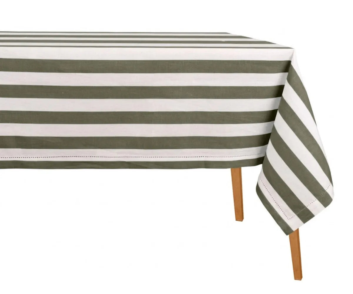 Woven striped cotton linen rectangle tablecloth draped neatly on a dining table for casual entertaining Woven striped cotton linen rectangle tablecloth draped neatly on a dining table for casual entertaining