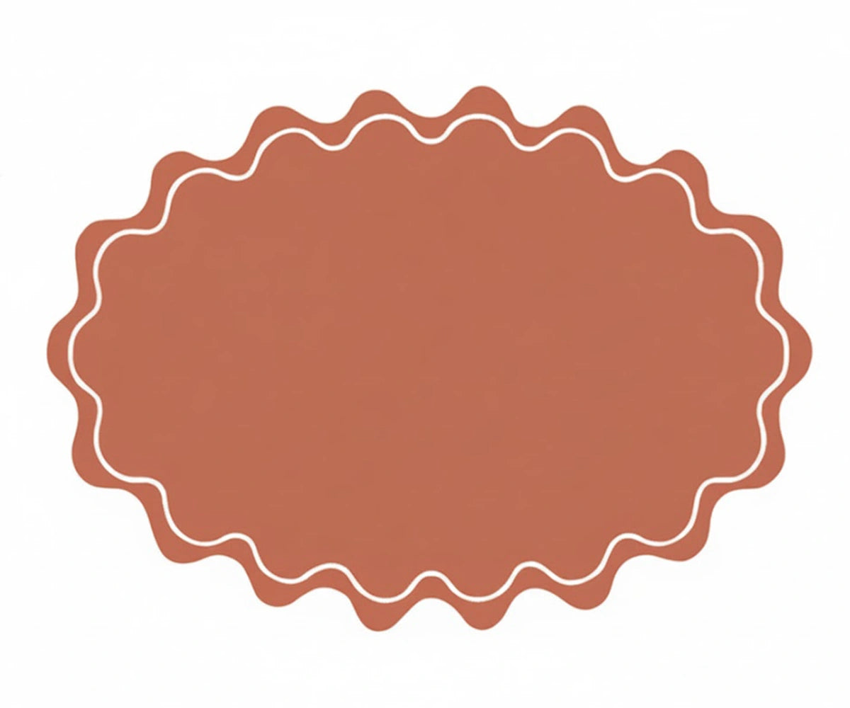 Terracotta oval cotton placemat with scalloped edge design, ideal for sustainable and stylish table décor Terracotta oval cotton placemat with scalloped edge design, ideal for sustainable and stylish table décor