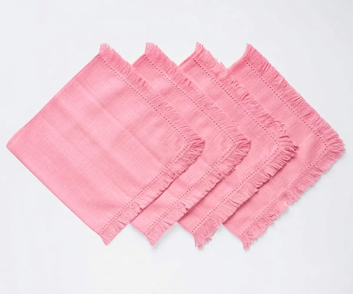 Reusable cotton cloth napkins with decorative fringe edges, designed for elegant dining tables and everyday meals. Reusable cotton cloth napkins with decorative fringe edges, designed for elegant dining tables and everyday meals.