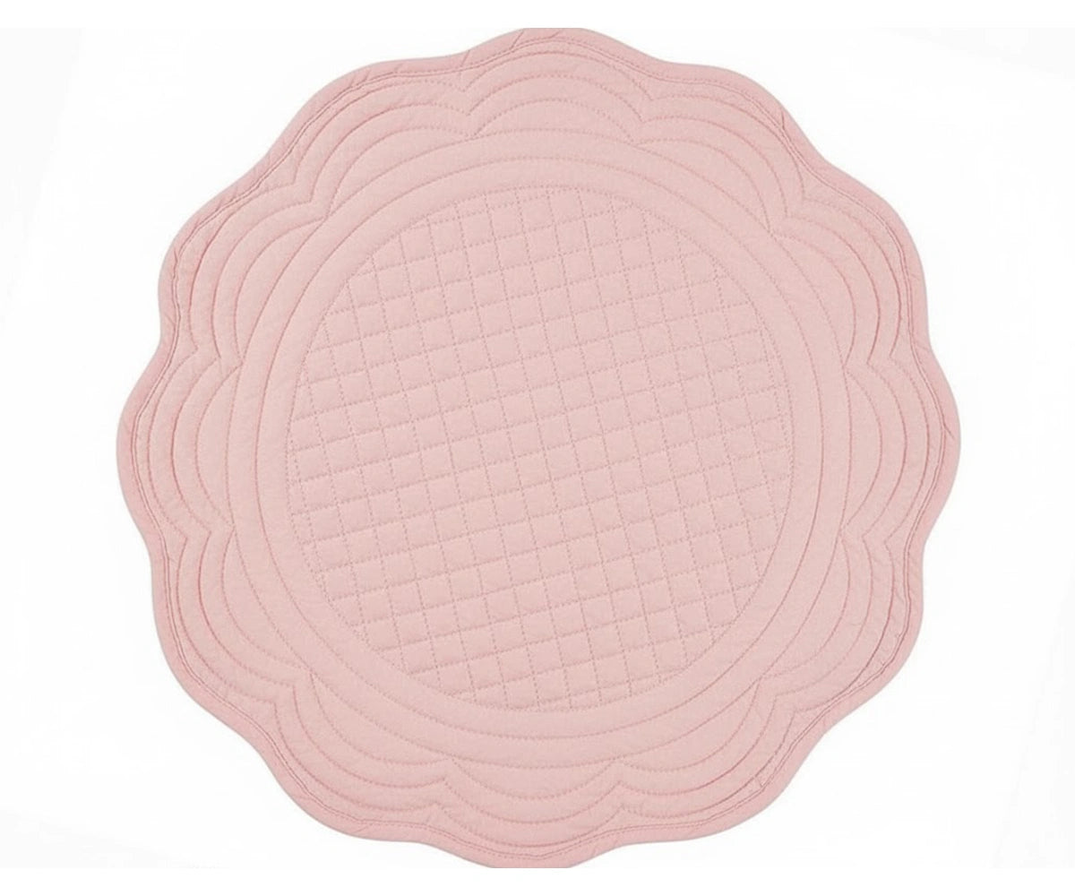 Peony color quilted cotton round placemat with scalloped edge for refined and elegant table décor Peony color quilted cotton round placemat with scalloped edge for refined and elegant table décor