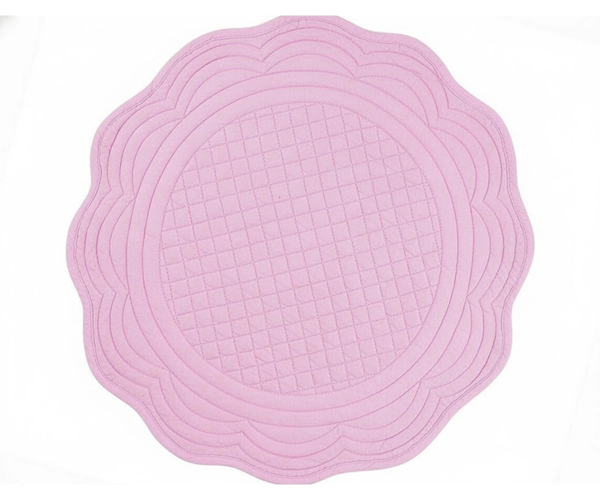 Pink quilted cotton round placemat with scalloped edge for soft romantic and Valentine table décor Pink quilted cotton round placemat with scalloped edge for soft romantic and Valentine table décor
