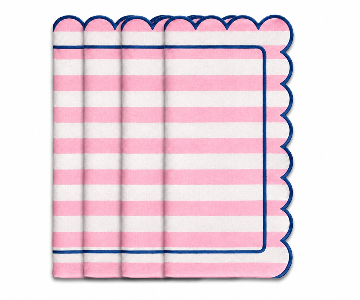 Pink and white striped cloth napkin with scalloped edges and navy trim for elegant table settings Pink and white striped cloth napkin with scalloped edges and navy trim for elegant table settings