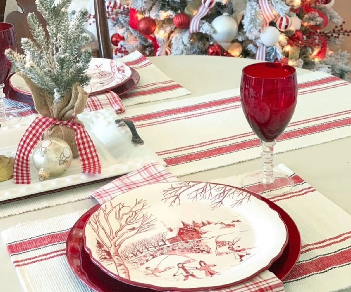 Festive table setting with red and white striped placemats. Festive table setting with red and white striped placemats.
