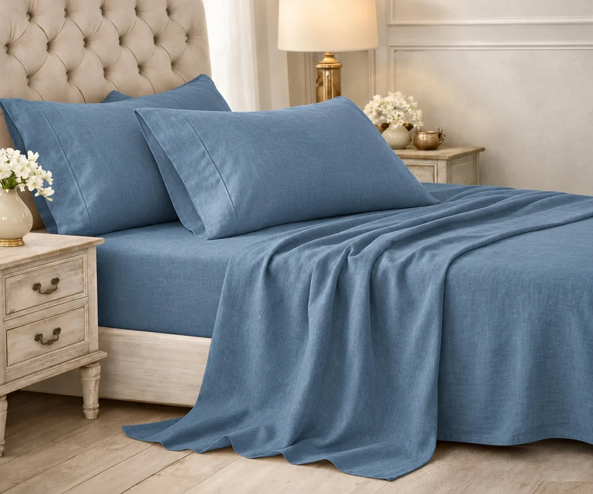 Solid dusty blue plain cotton bedding set styled on a bed in an elegant bedroom. Solid dusty blue plain cotton bedding set styled on a bed in an elegant bedroom.