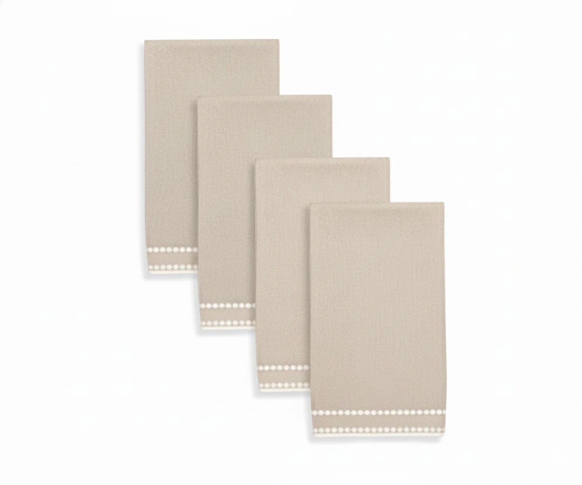 Beige napkin with soft pearl dot embroidery, offering a neutral and timeless table accent. Beige napkin with soft pearl dot embroidery, offering a neutral and timeless table accent.