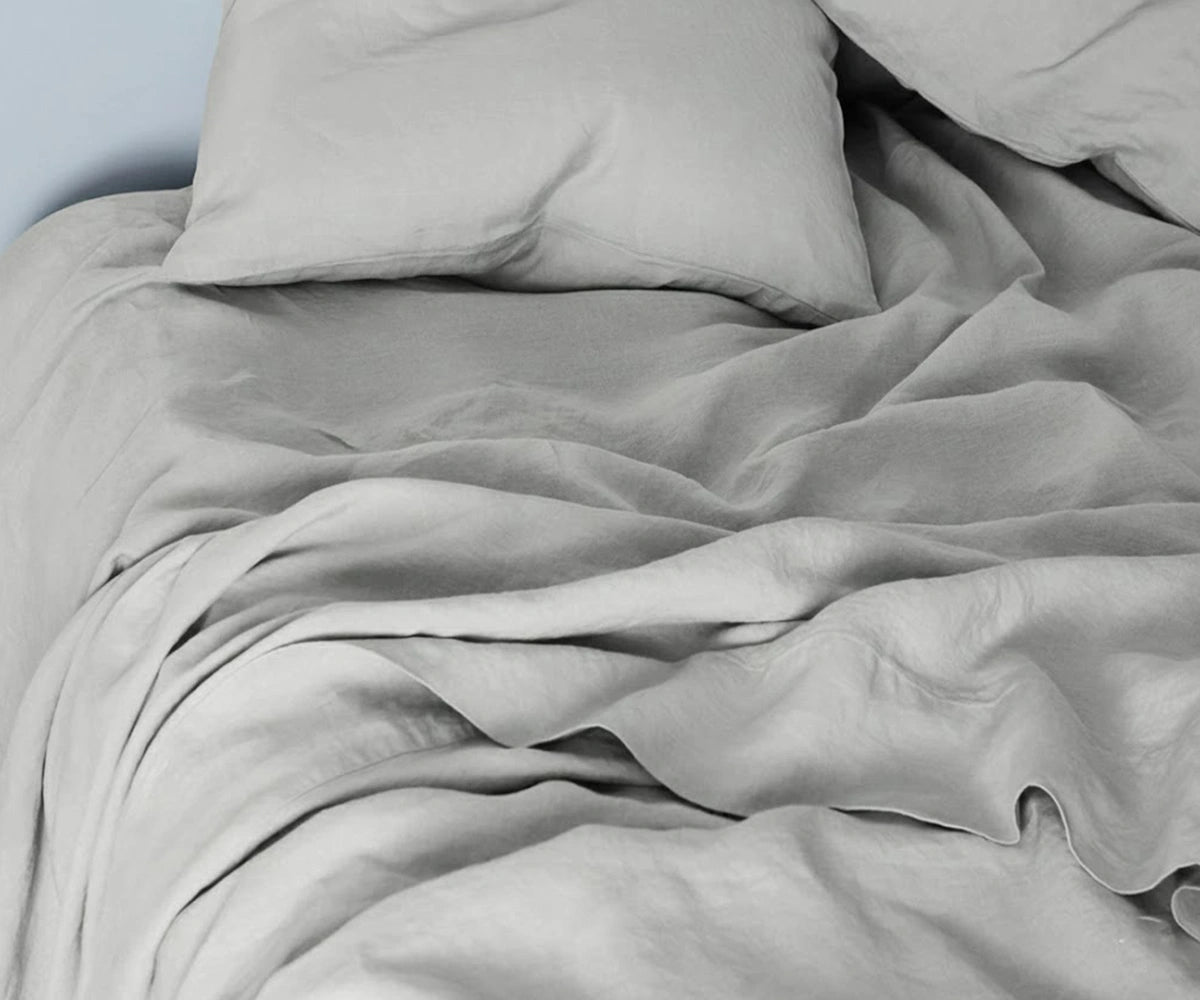 Light grey linen bedding set featuring breathable flax linen sheets and duvet cover for a soft, calming bedroom look. Light grey linen bedding set featuring breathable flax linen sheets and duvet cover for a soft, calming bedroom look.