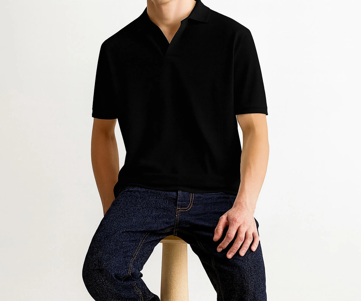 Classic Black Men’s Polo T-Shirt – for casual and workwear outfits. Person wearing a black polo shirts for men and dark jeans on a white background Classic Black Men’s Polo T-Shirt – for casual and workwear outfits. Person wearing a black polo shirts for men and dark jeans on a white background